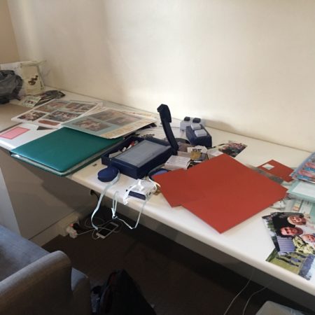 A messy scrapbooking desk